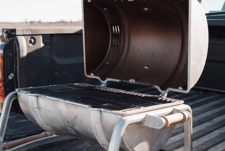 The Smokin' Keg grill on a truck tailgate